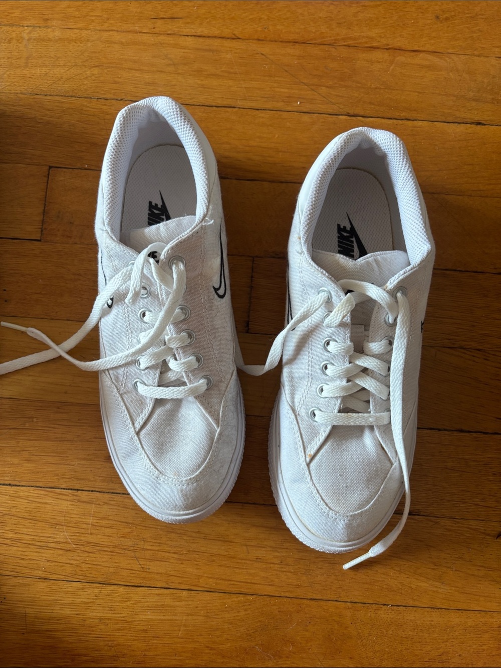 Nike White Low-Top Canvas Sneakers with Black Swoosh